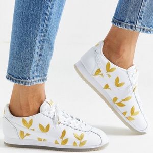 Nike gold leaf motif embroidered white Cortez